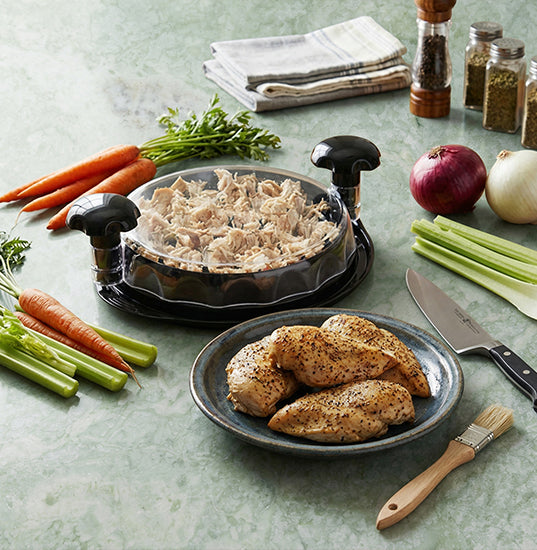 Two mason jars with black lids, one with mung beans and the other with colorful candies, labeled Mason Genie Lid Adaptor.