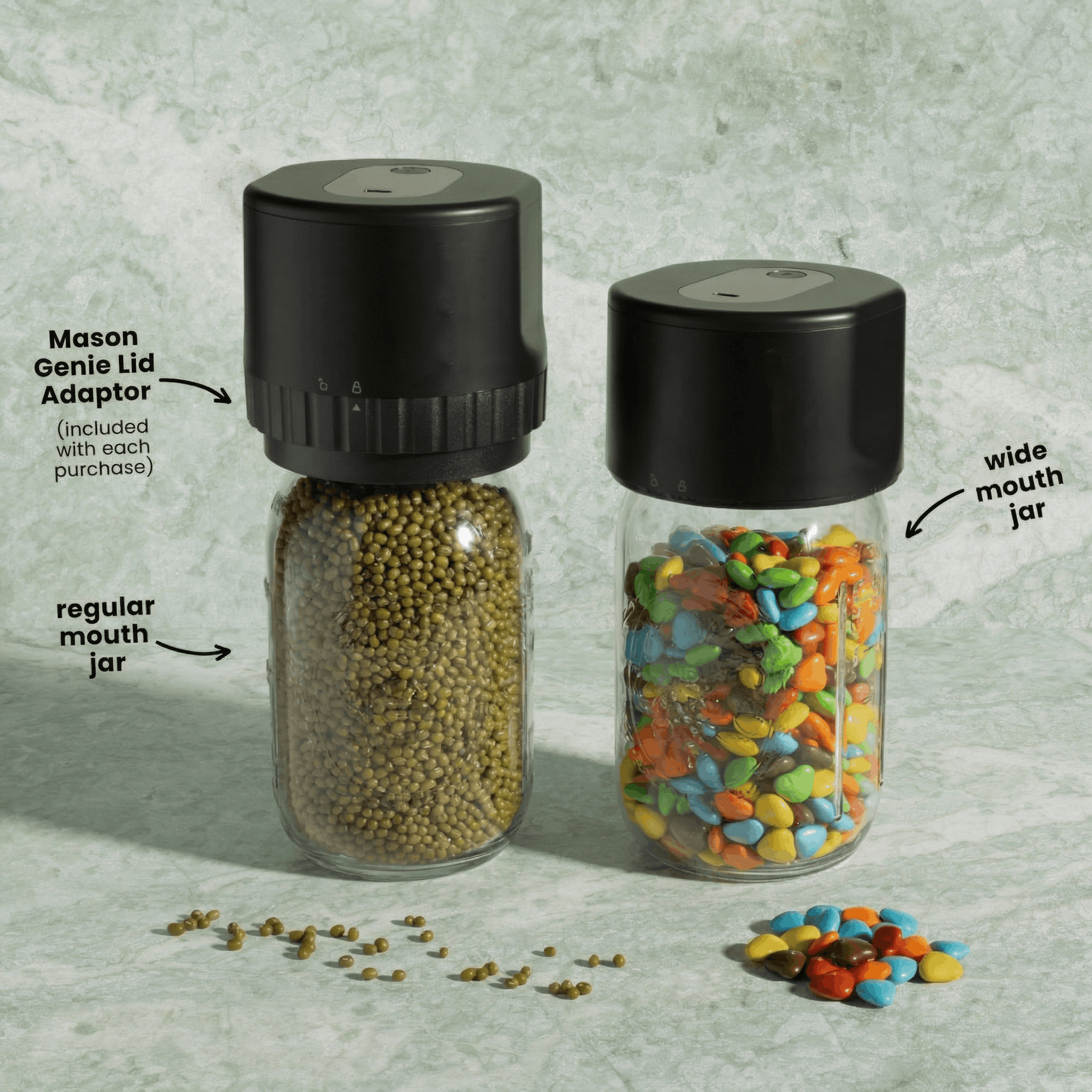 Two mason jars with black lids, one with mung beans and the other with colorful candies, labeled Mason Genie Lid Adaptor.